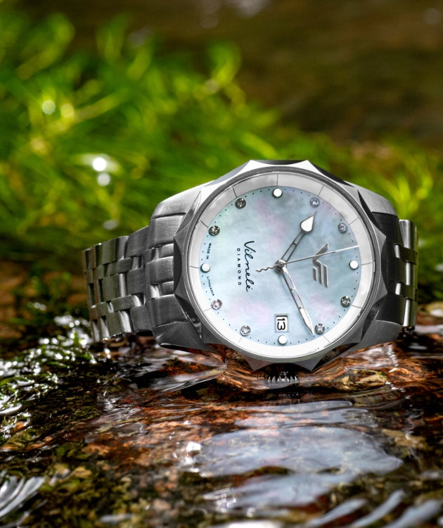 Inspired by the Vilnelė River, an elegant, solar-powered timepiece that balances natural grace with effortless practicality.