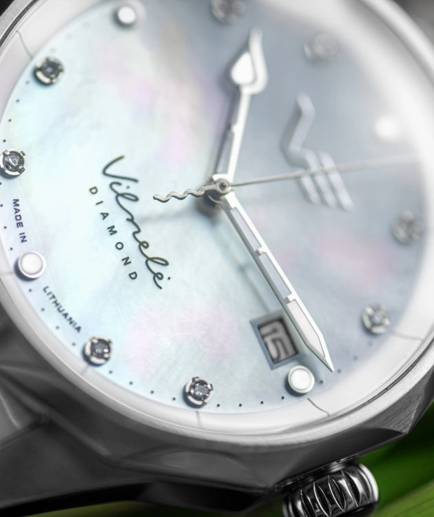 Inspired by the Vilnelė River, an elegant, solar-powered timepiece that balances natural grace with effortless practicality.