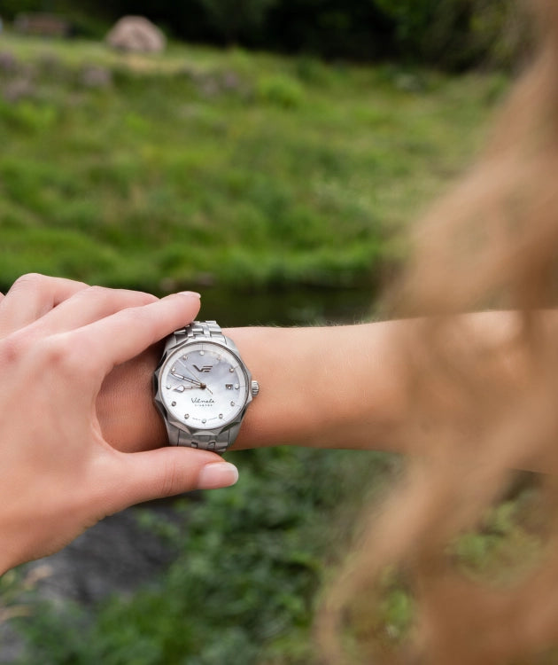 Inspired by the Vilnelė River, an elegant, solar-powered timepiece that balances natural grace with effortless practicality.